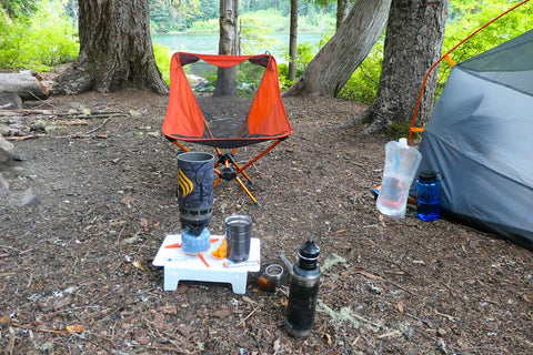 A camping equipment in the woods
Description automatically generated